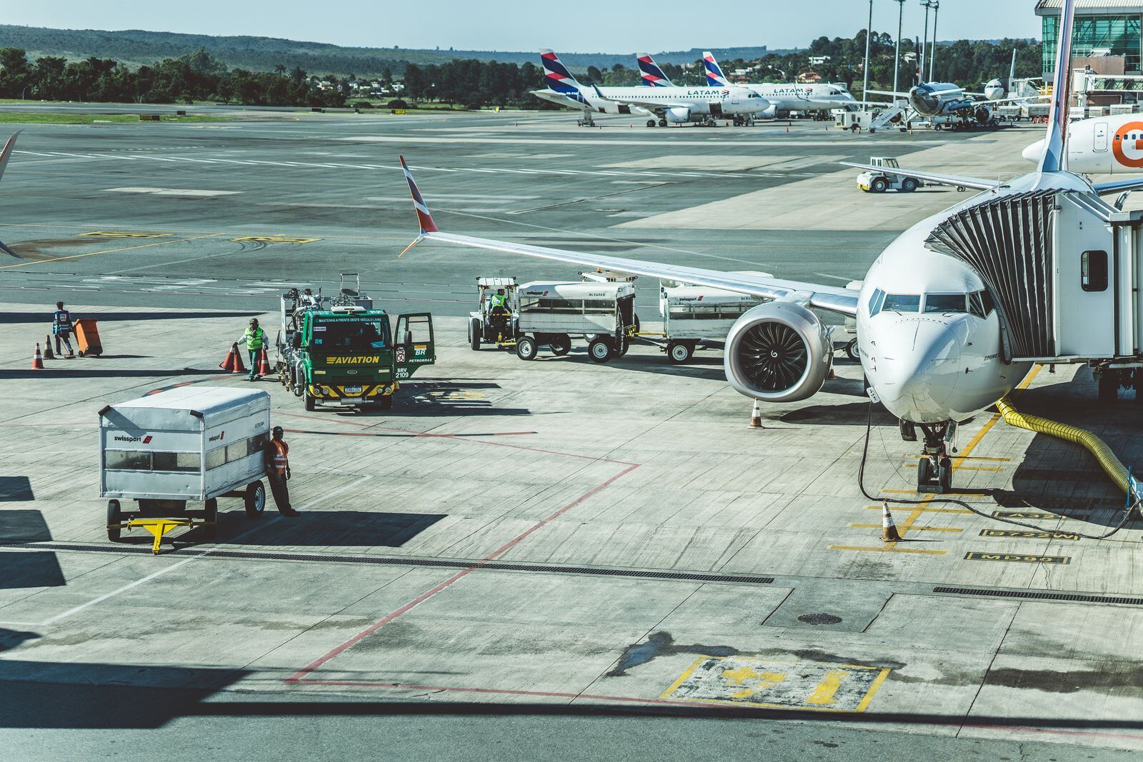 Aircraft connected to a jet bridge on an airport apron